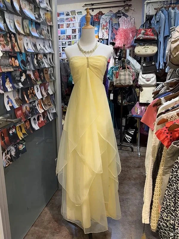 Yellow sleeveless A-line chiffon waist cinching long homecoming dress