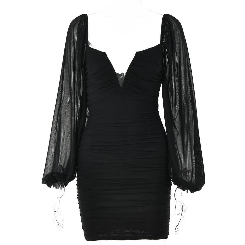 Close-up of the ruched mesh fabric on the black bodycon mini dress.