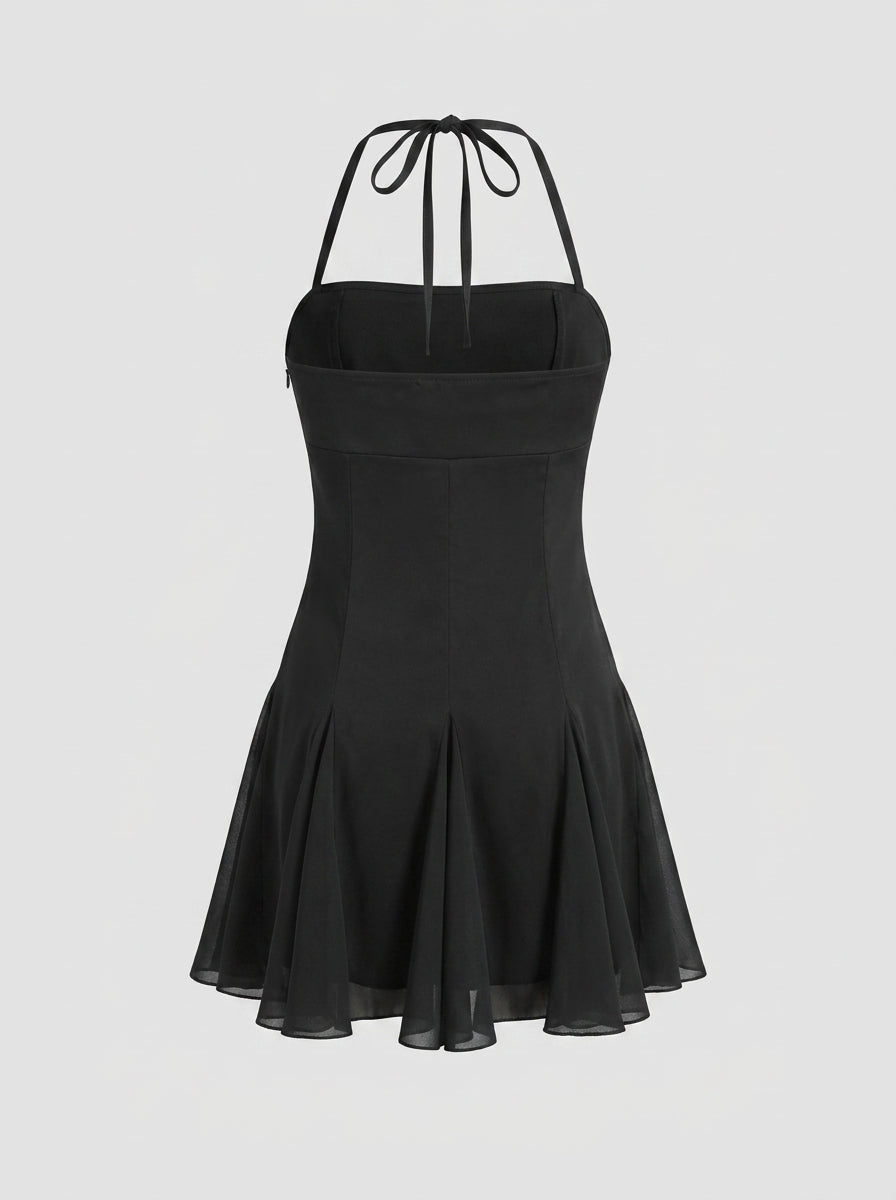 Back view of a black halter A-line mini dress, showing the tie-back neckline.