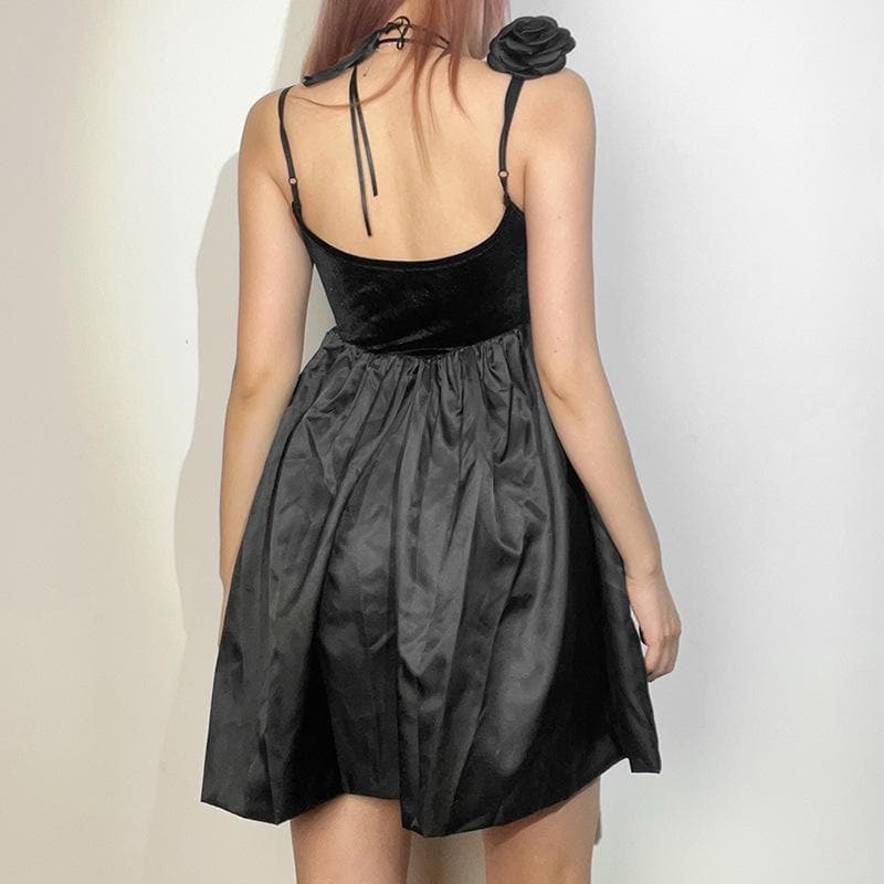 Back view of the black velvet A-line mini homecoming dress showing criss-cross ties.