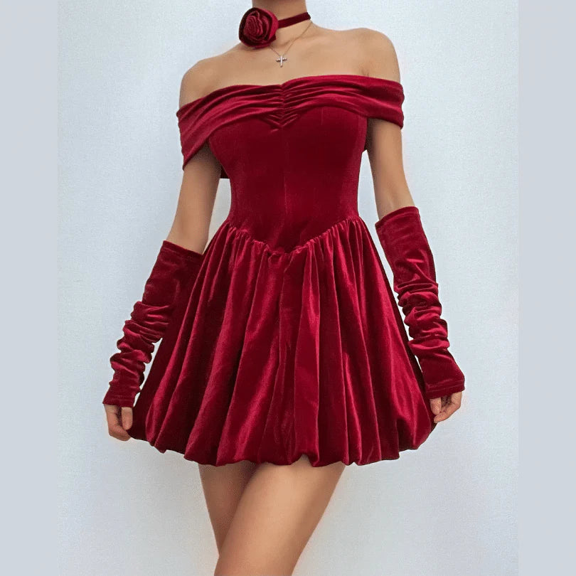 Model wearing a burgundy velvet off-shoulder ruched A-line mini dress, front view.