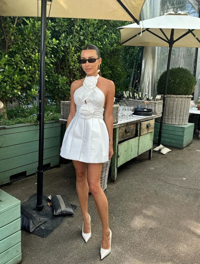 Side and back view of the short halter A-line satin dress with floral and pearl details.