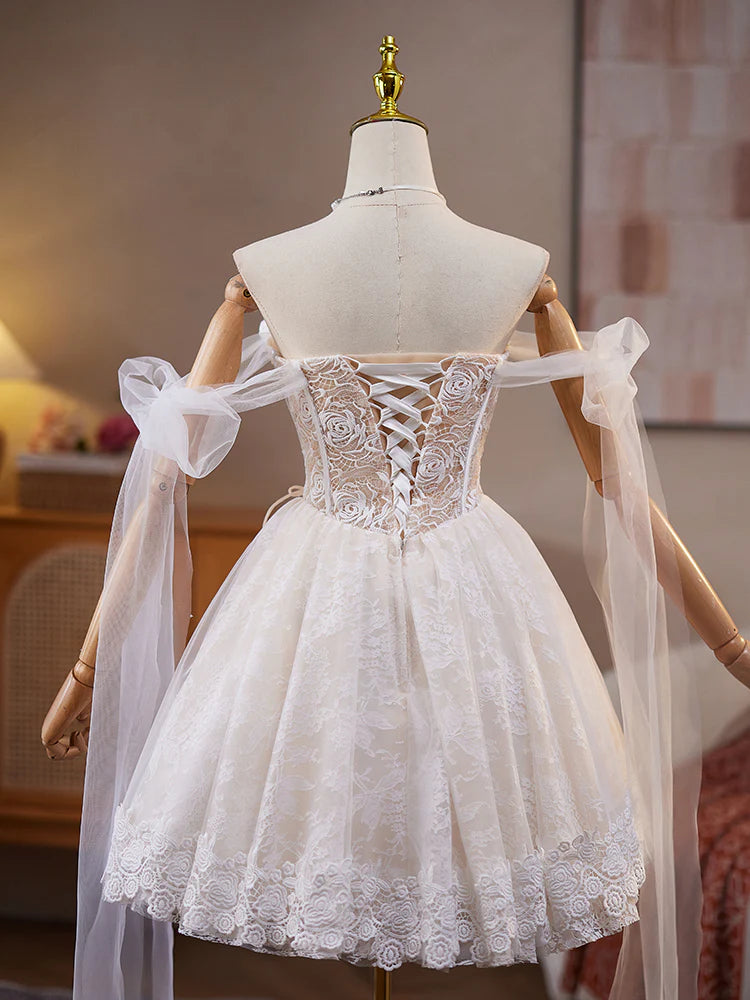 Side view of a model showcasing the light champagne A-line off-shoulder short homecoming dress.
