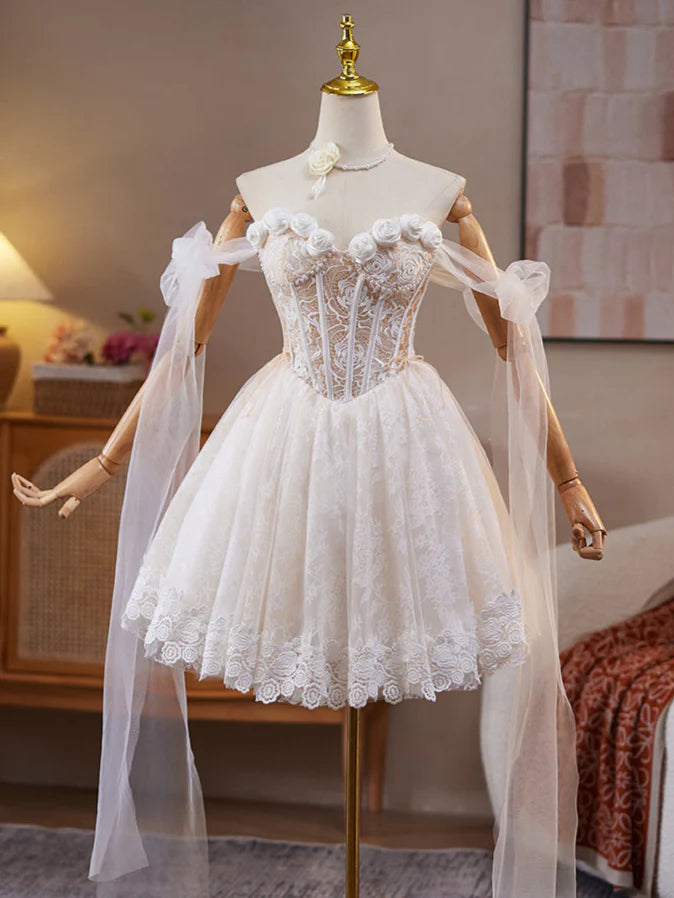Model posing in a light champagne A-line off-shoulder short dress, highlighting the elegant design.
