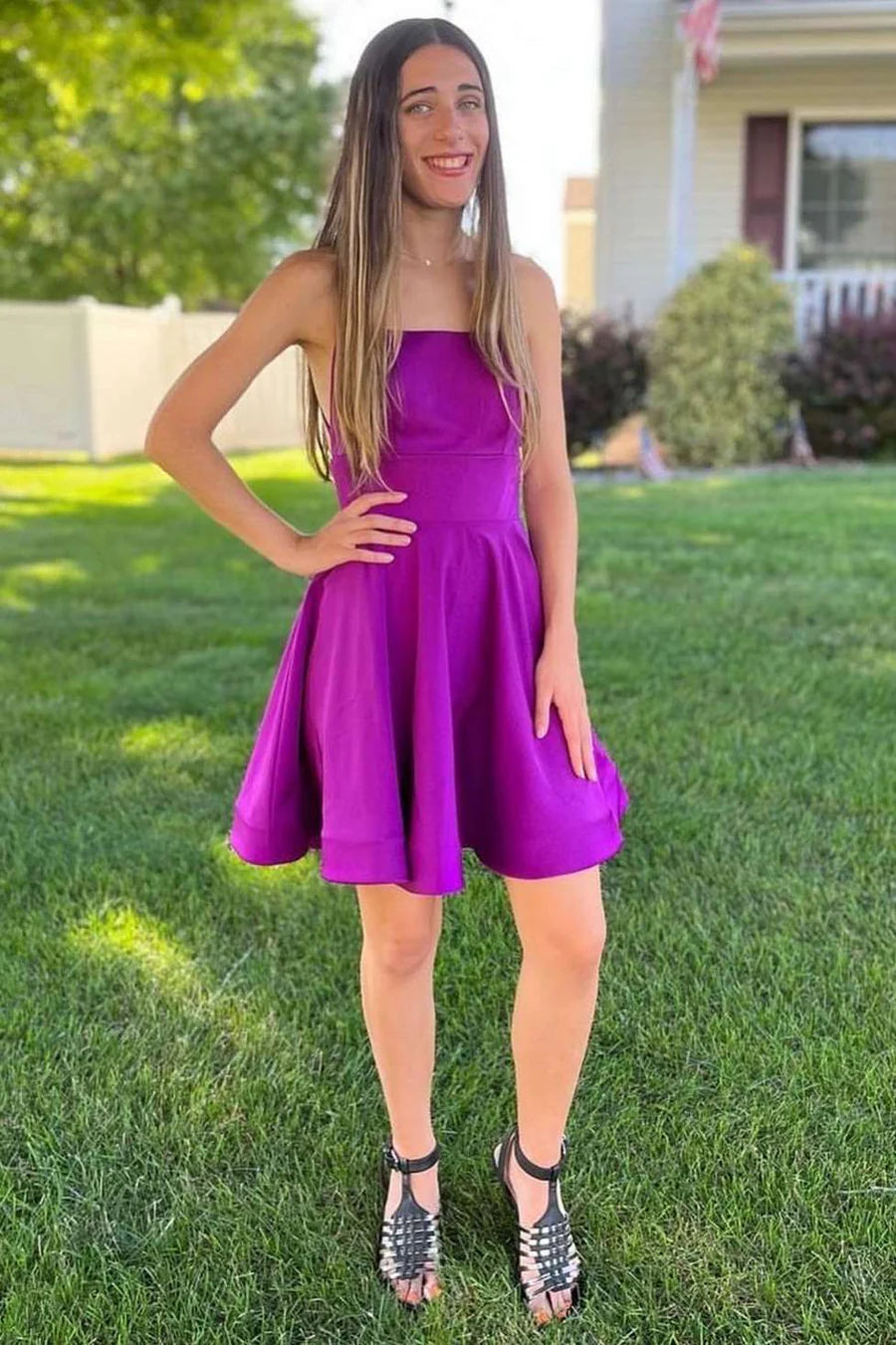 Model wearing a purple A-line homecoming dress with a straight neckline.