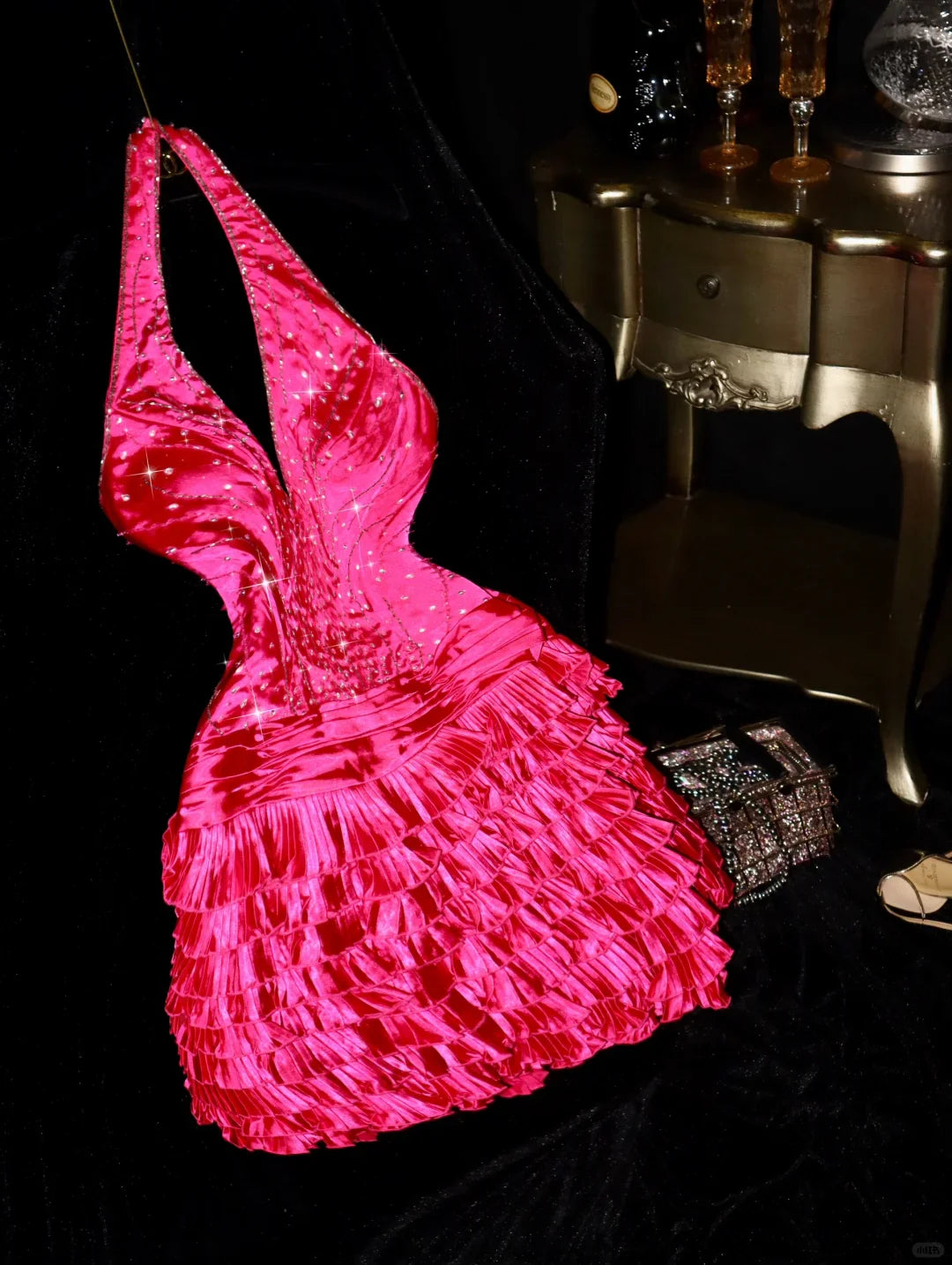 Model wearing a Barbie pink A-line halter short homecoming dress with beaded details.