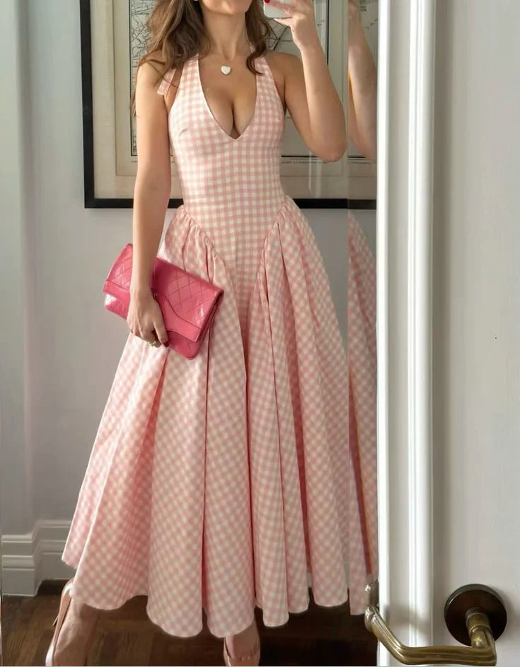 Model wearing an elegant A-line halter satin plaid evening gown.