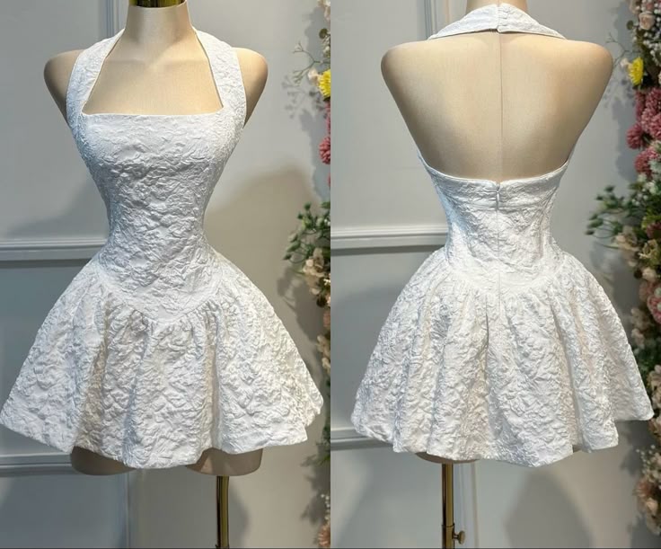 Model wearing a chic white A-line halter short homecoming dress with a unique waist design.