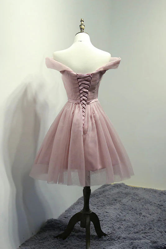 Back view of a model in a pink off-shoulder short homecoming dress.