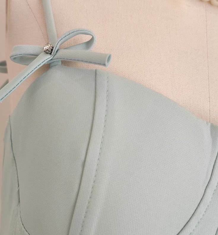 Detail of the A-line spaghetti strap short dress fabric.