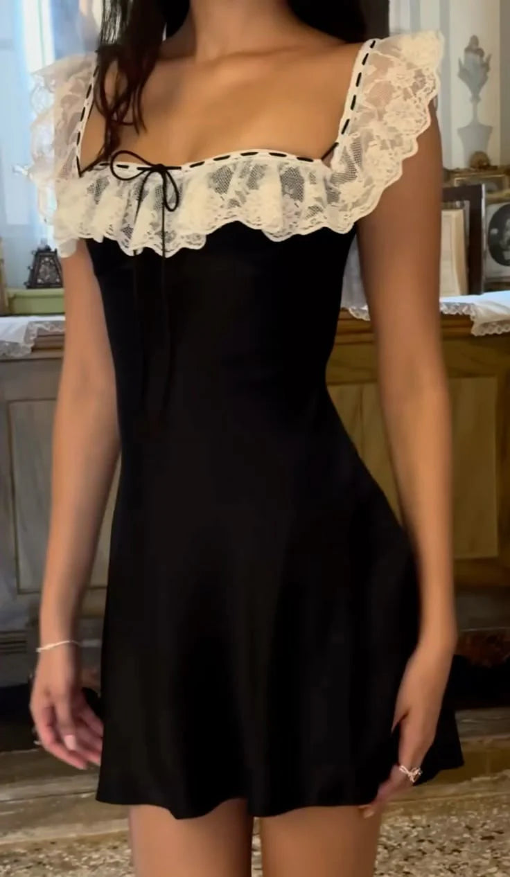 Model wearing a light blue A-line square neck short homecoming dress with satin and lace details.