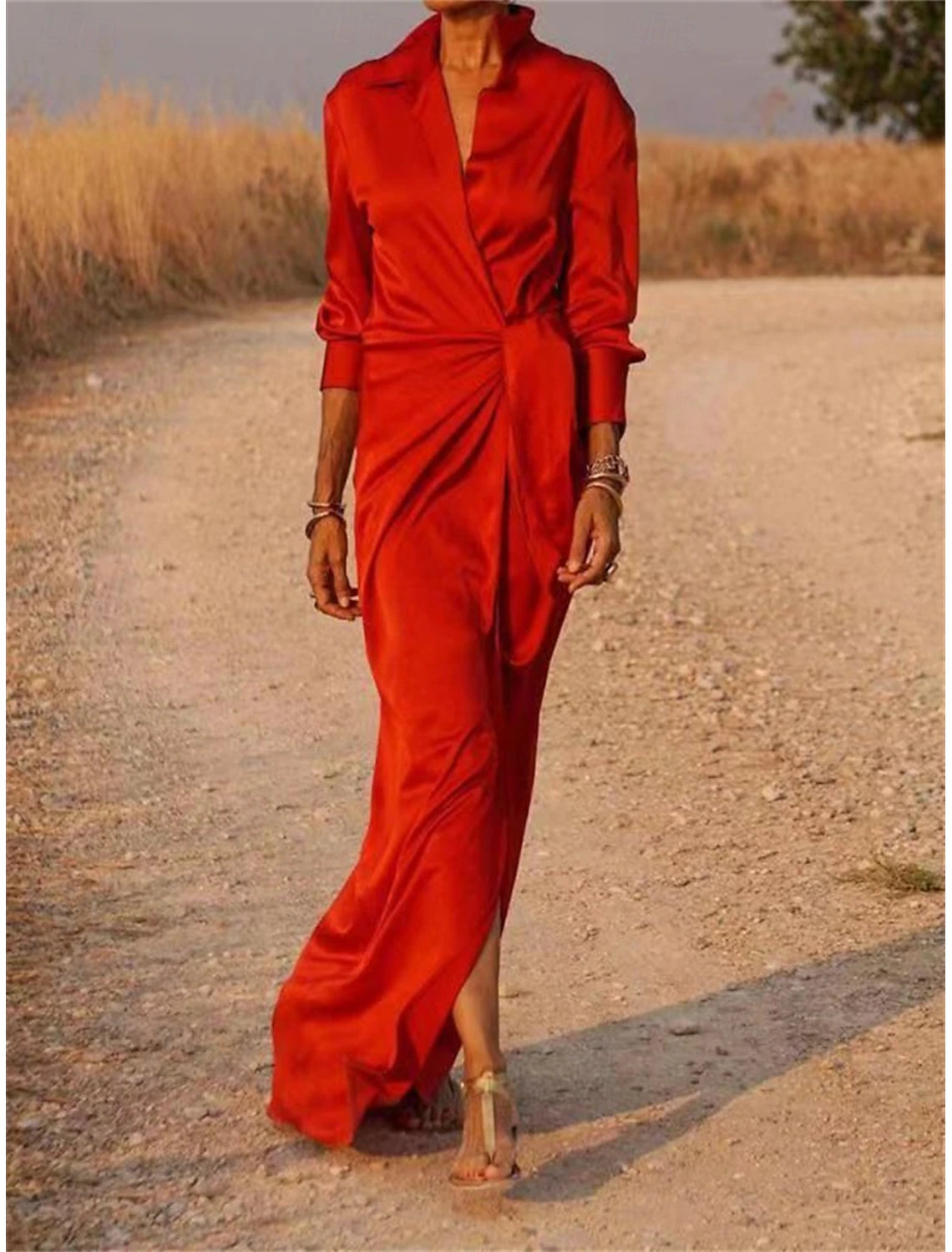 Woman wearing a chic button-down flowy maxi shirt dress.
