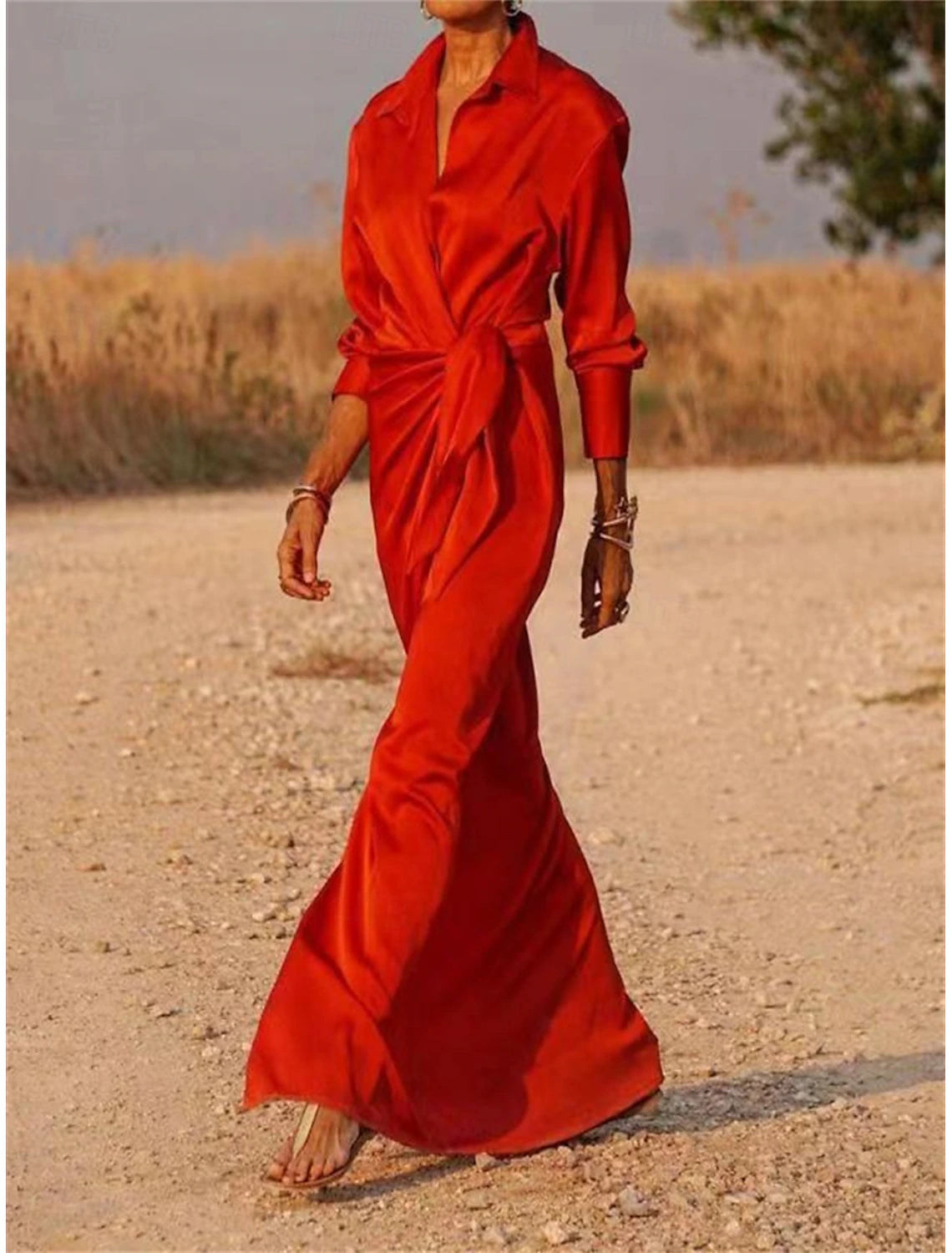 Woman walking in a stylish flowy maxi shirt dress.