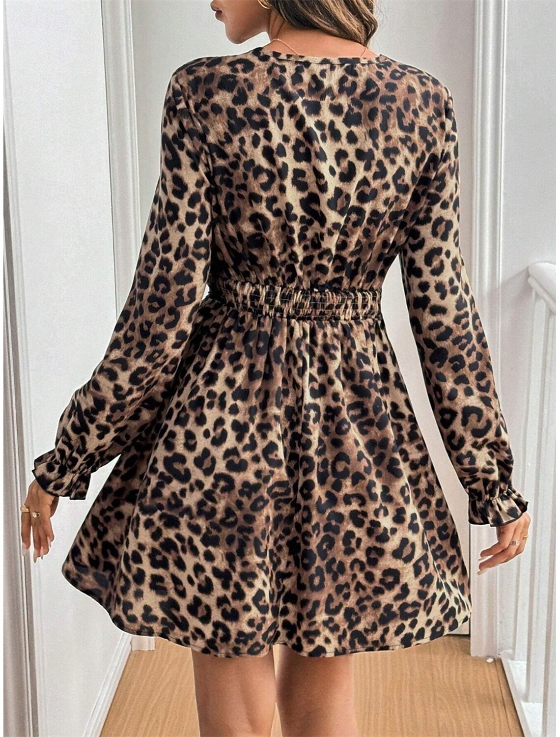 Model showcasing the regular fit leopard print maxi dress, highlighting its flowing silhouette.