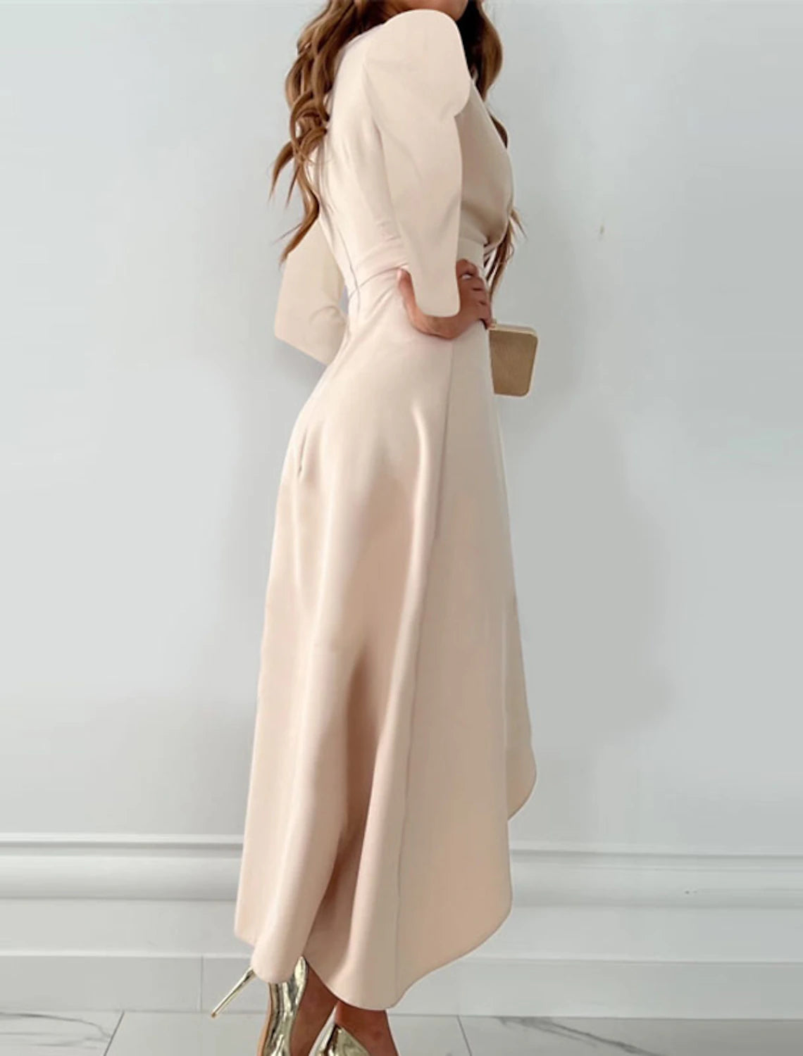 Woman wearing a red ruffle V-neck long sleeve midi dress.
