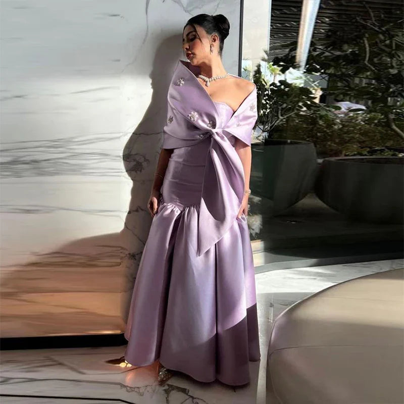 Close-up of the satin fabric and strapless top of the evening gown.