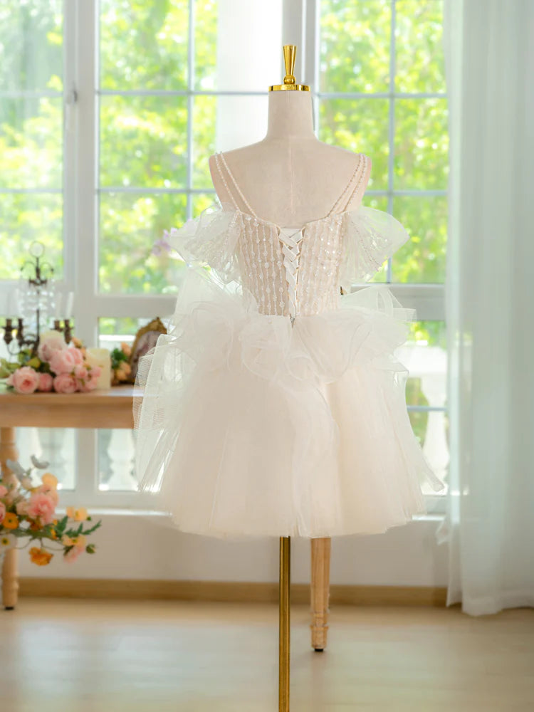 Back view of the ivory short prom dress with delicate lace bodice.