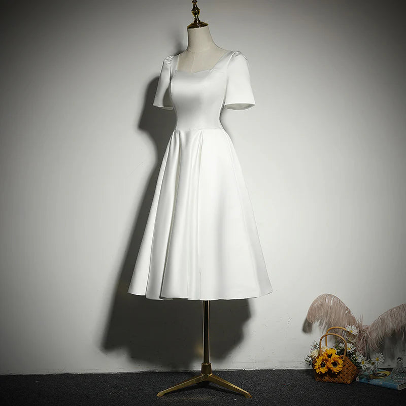 Back view of the sleeveless white A-line prom dress.