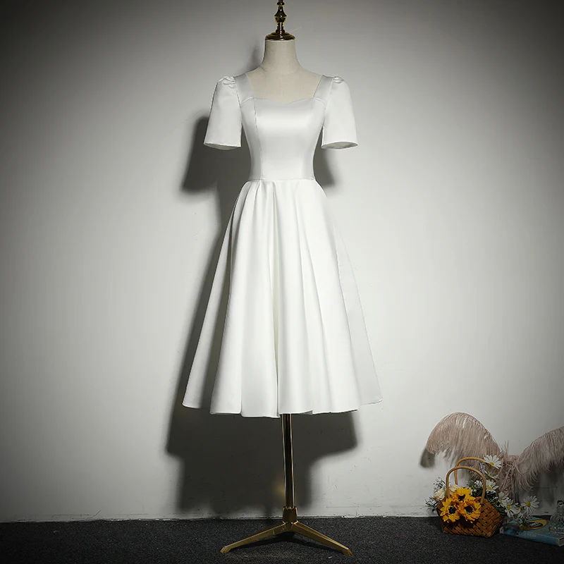 Front view of the classic white short prom dress with A-line silhouette.