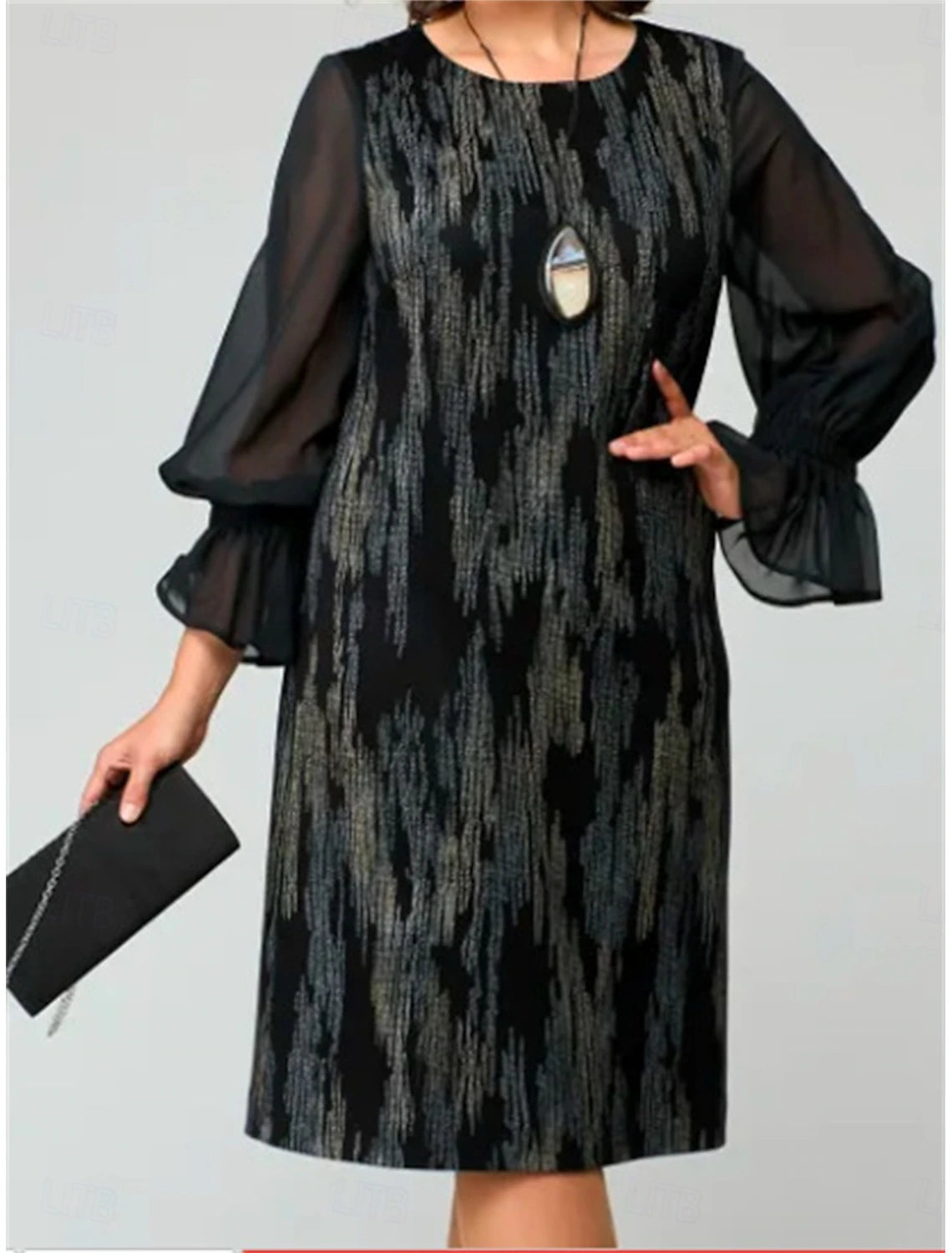 Woman wearing a loose fit long sleeve crew neck midi dress.
