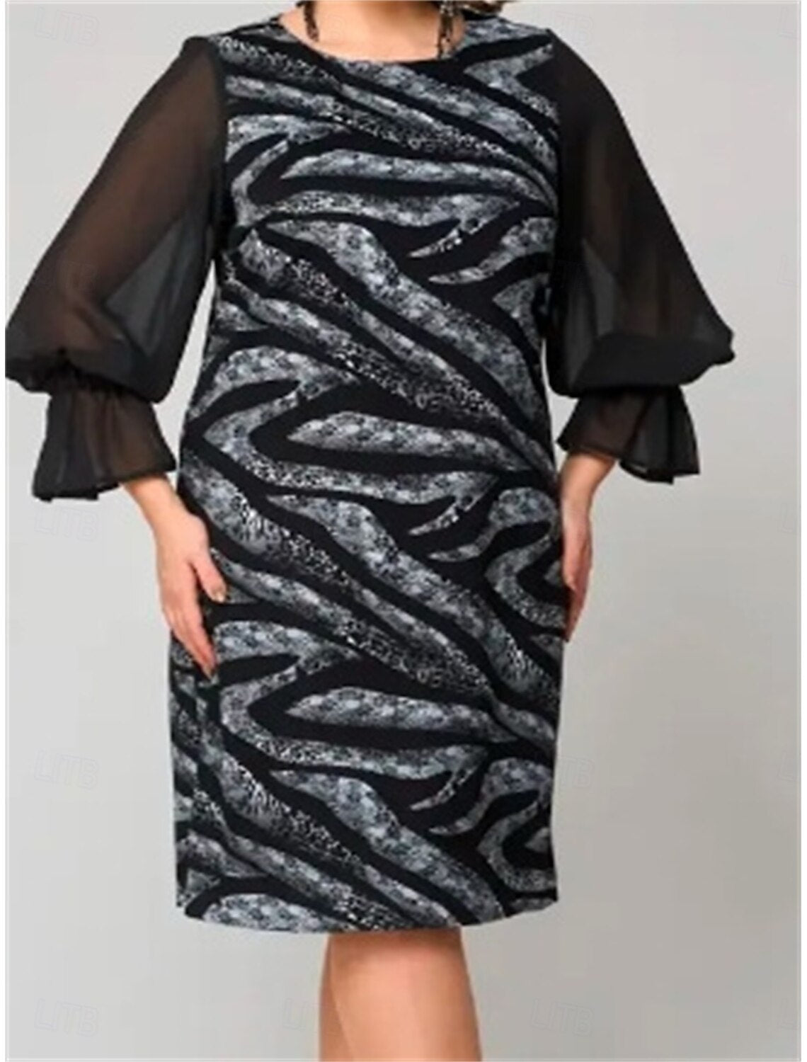 Back view of a woman in a casual crew neck midi dress.