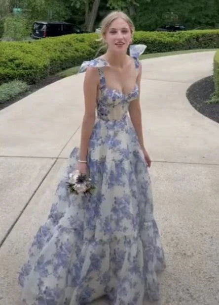 Side view of the blue floral A-line prom dress, showing the tiered tulle skirt.