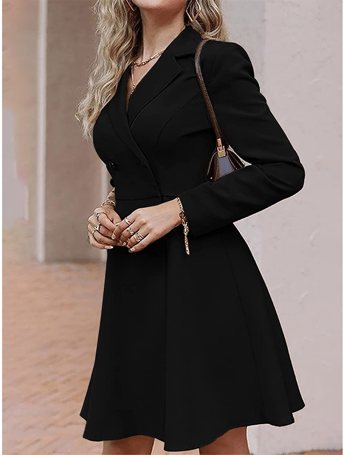 Woman posing in a blue button-front long sleeve midi party dress.