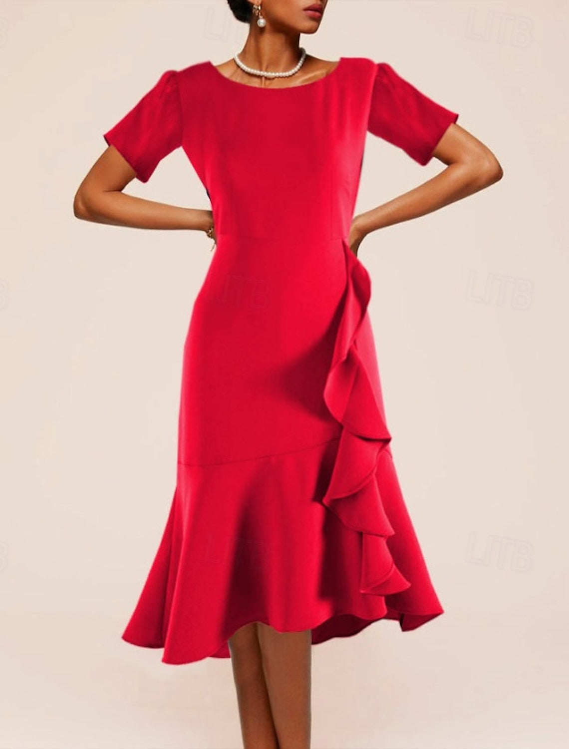 Woman wearing a plain black short sleeve crew neck A-line midi dress.
