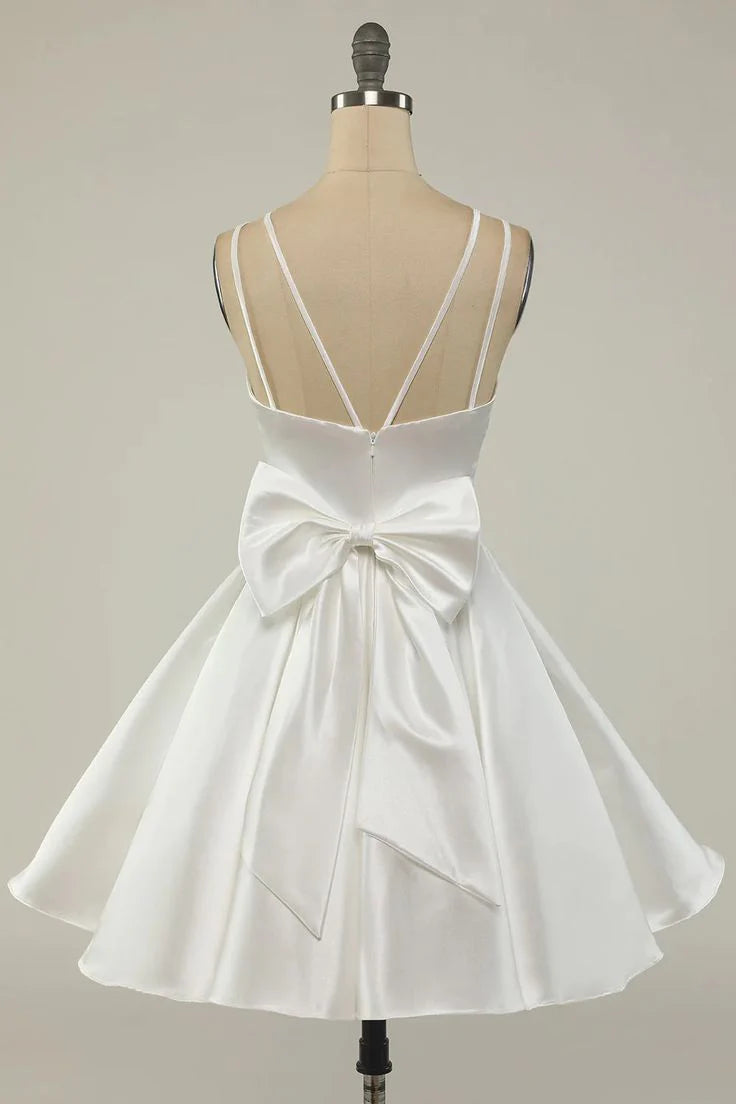 Back view of a model in a white satin short party dress.