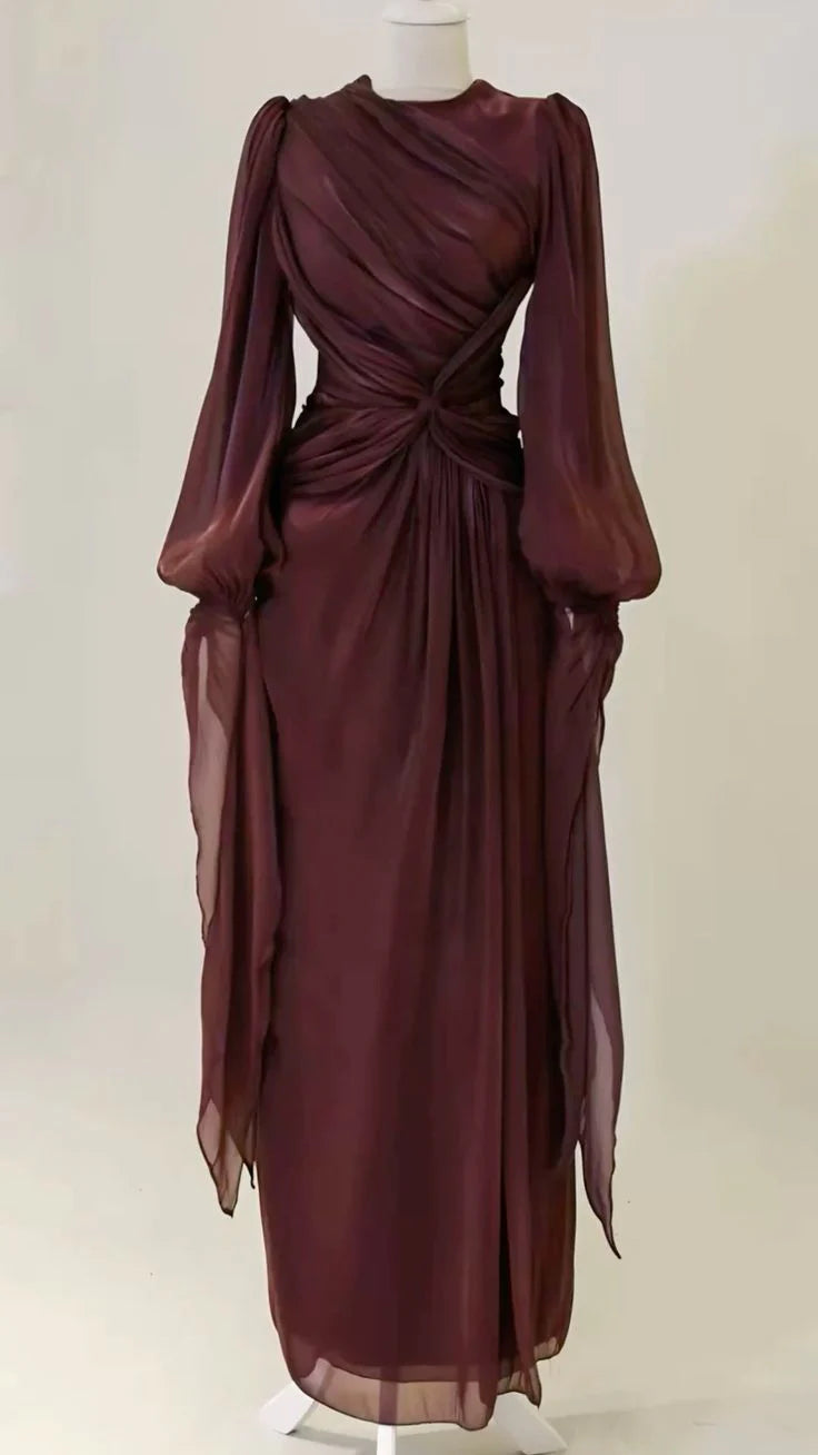 Elegant A-line long sleeve prom gown with a cinched waist, full length view.
