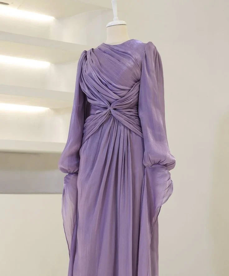 A-line long sleeve prom gown, highlighting the flattering cinched waist detail.
