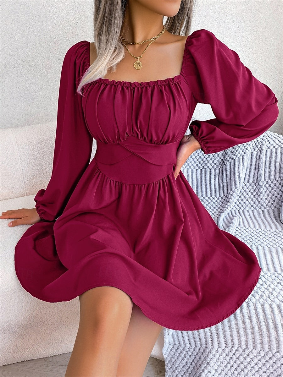 Side view of a woman in a regular fit A-line mini dress.