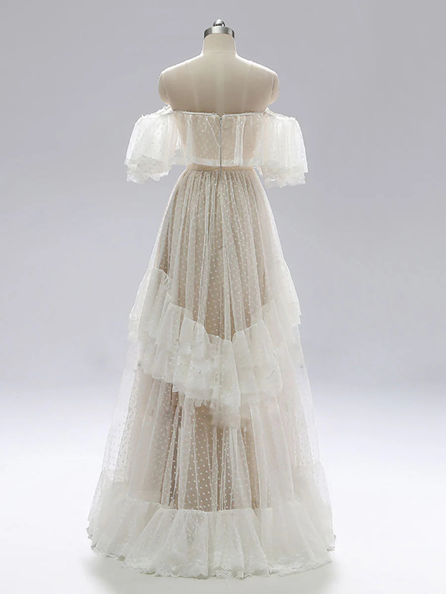 Elegant champagne A-line lace gown with off-shoulder neckline.