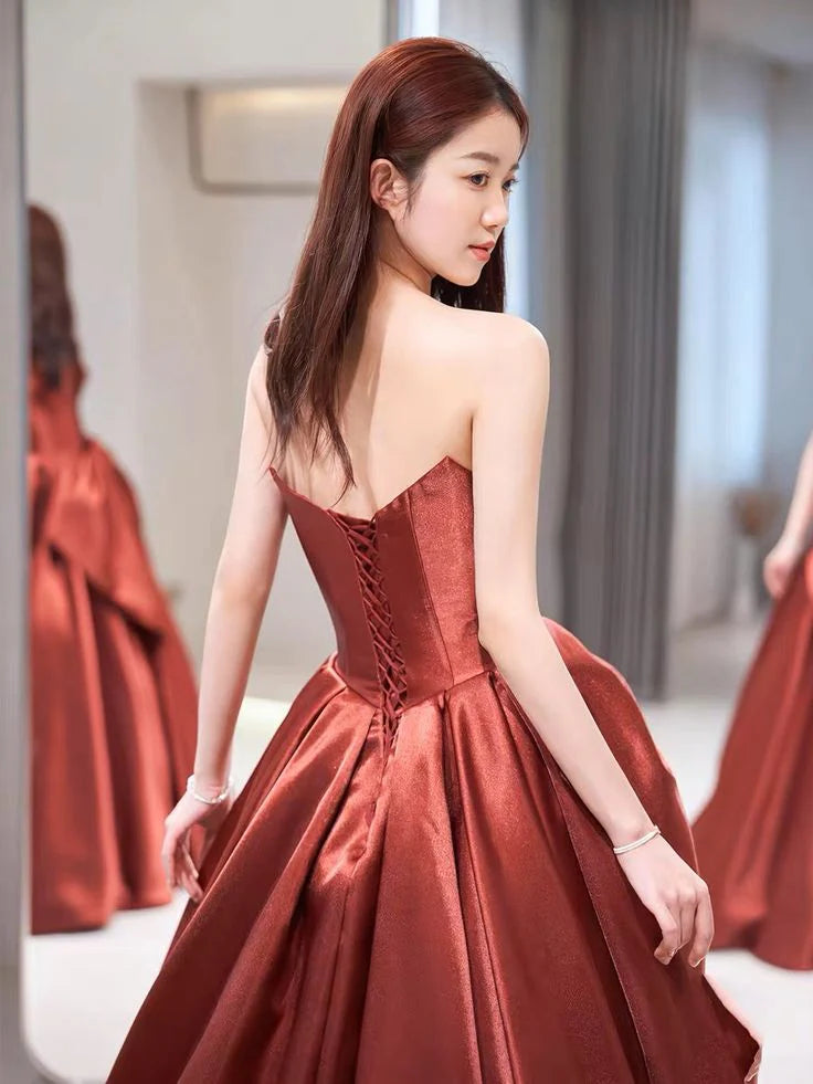 A-line off-the-shoulder satin evening dress, side profile.