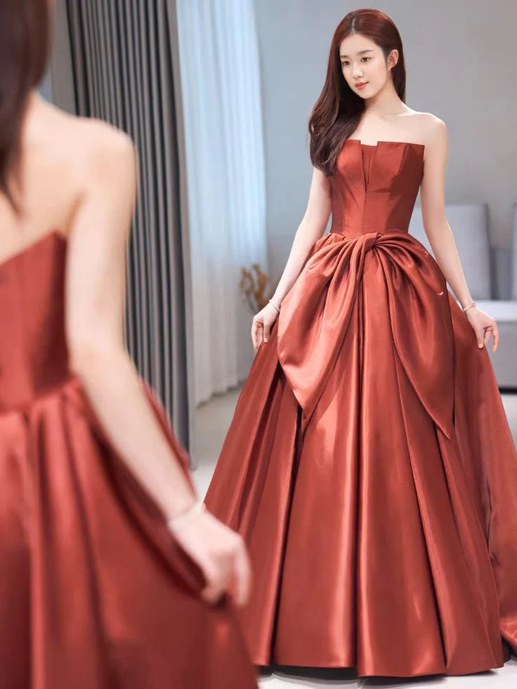Back view of A-line off-the-shoulder satin evening dress with lace-up detail.