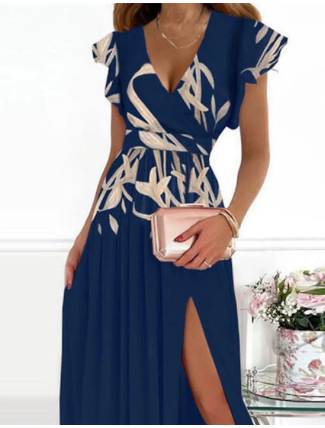 Back view of a woman in an elegant off-shoulder A-line maxi dress.