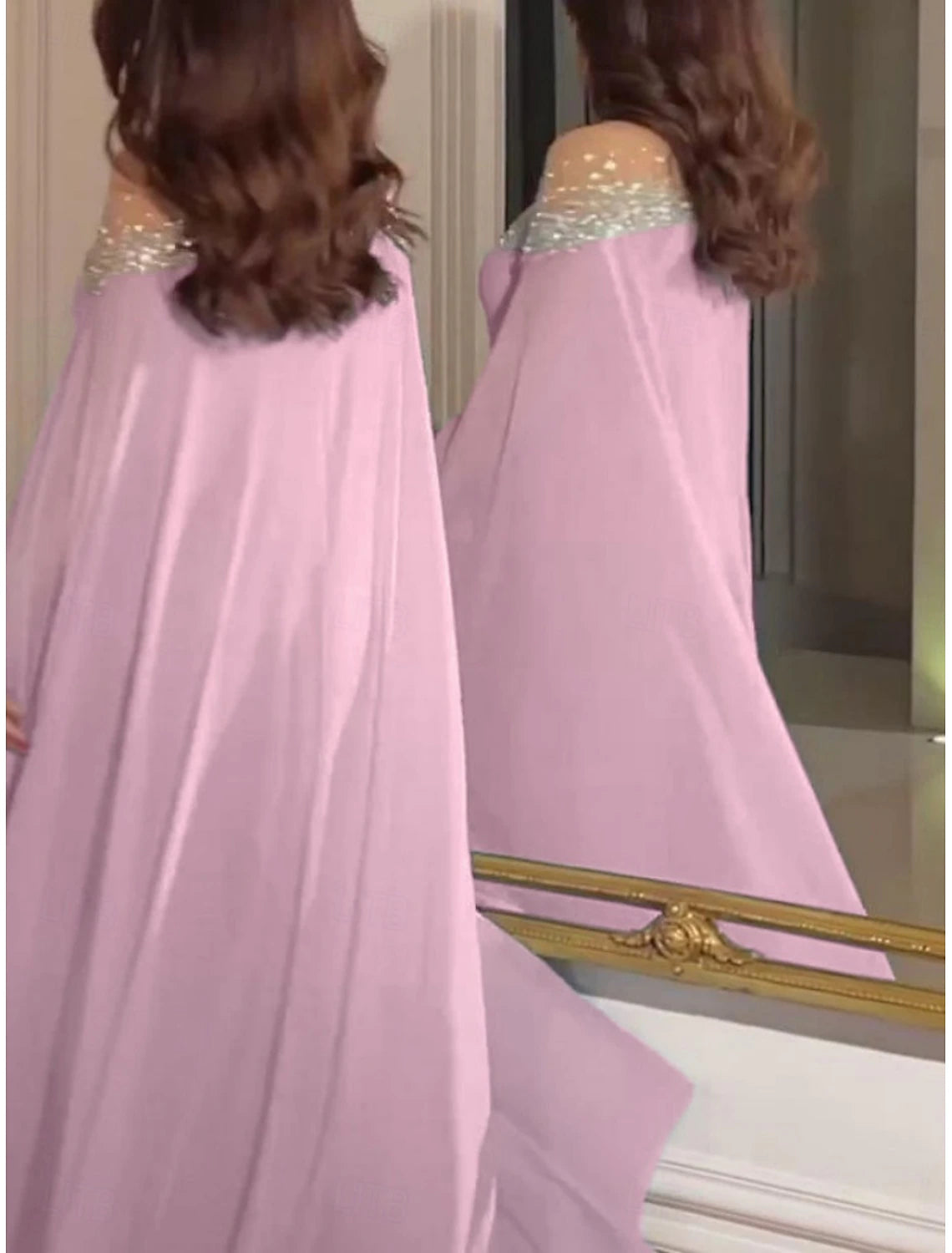 Full length view of a woman in an elegant purple A-line off-shoulder maxi dress.