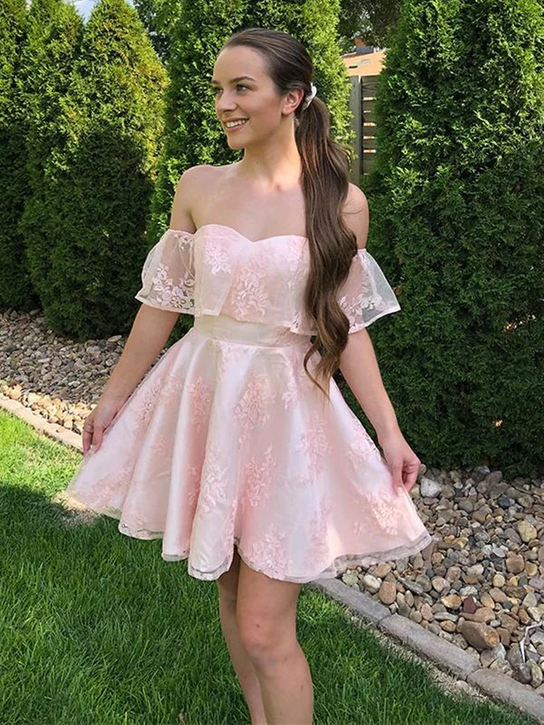 Model wearing a pink off-shoulder short lace dress.