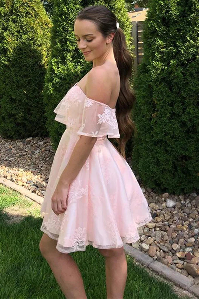 Side view of model in a pink off-shoulder lace homecoming dress.