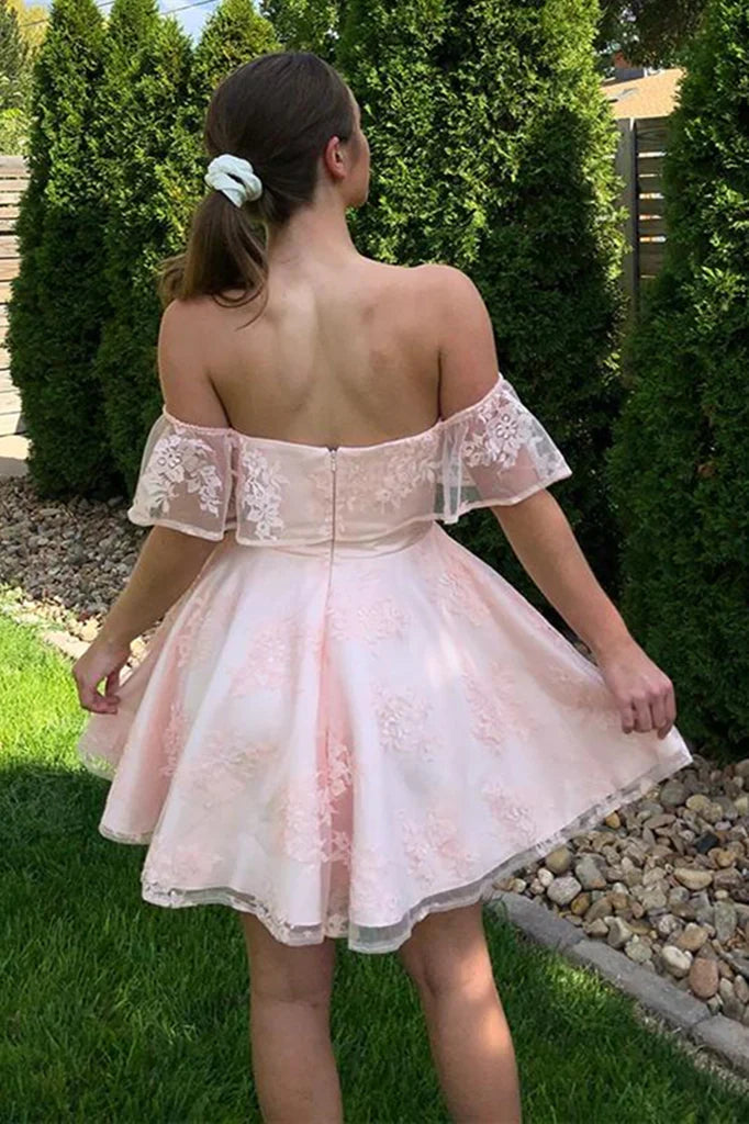 Back view of a pink lace off-shoulder graduation dress.