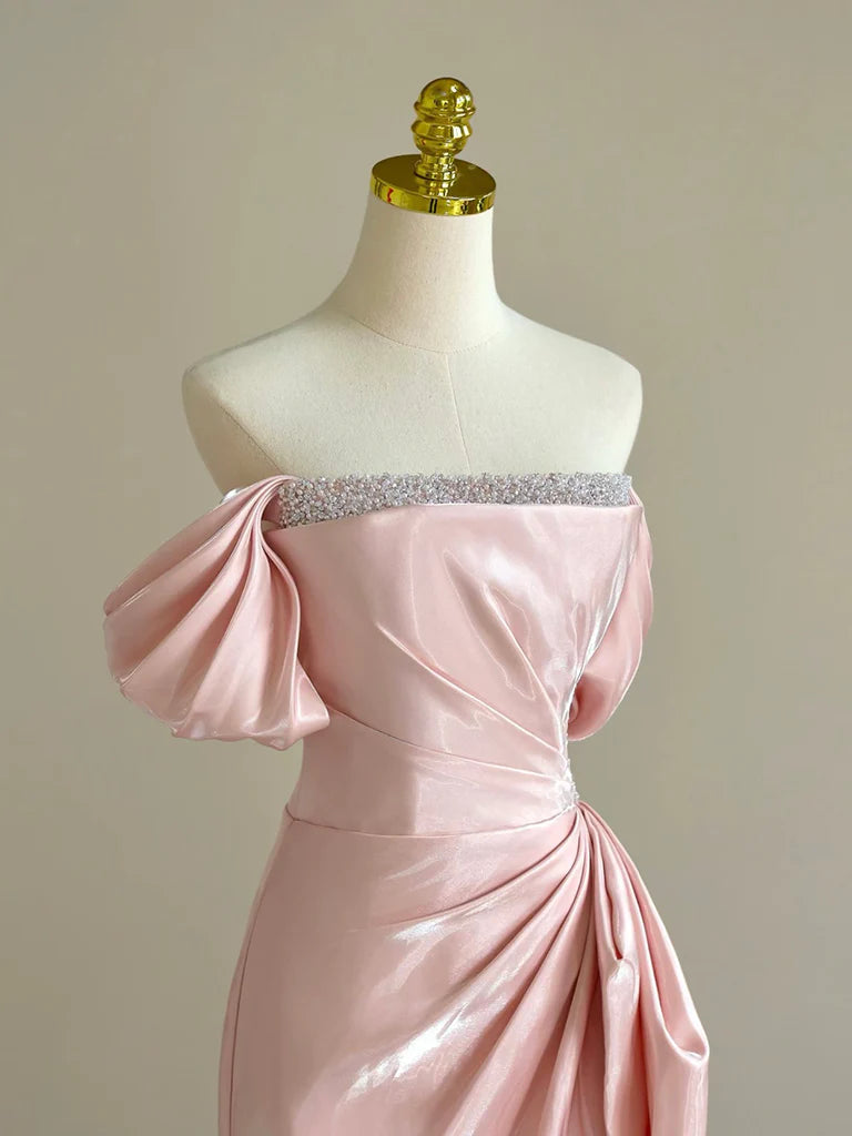 Side view of the A-line off-shoulder pink formal dress, showcasing its flowing silhouette.