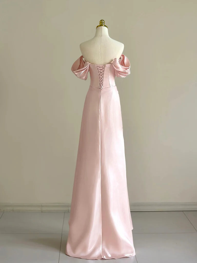 Back view of the pink long formal dress with off-shoulder neckline and beaded embellishments.