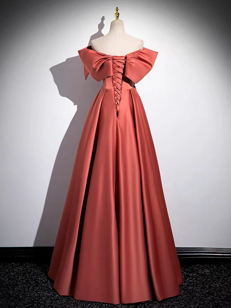 A close-up of the back of the watermelon red A-line off-shoulder satin long prom dress, showing the fabric and silhouette.