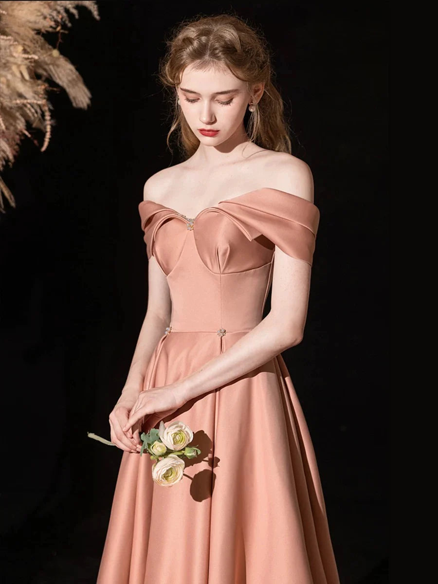 Back view of the flowing pink satin long evening gown.