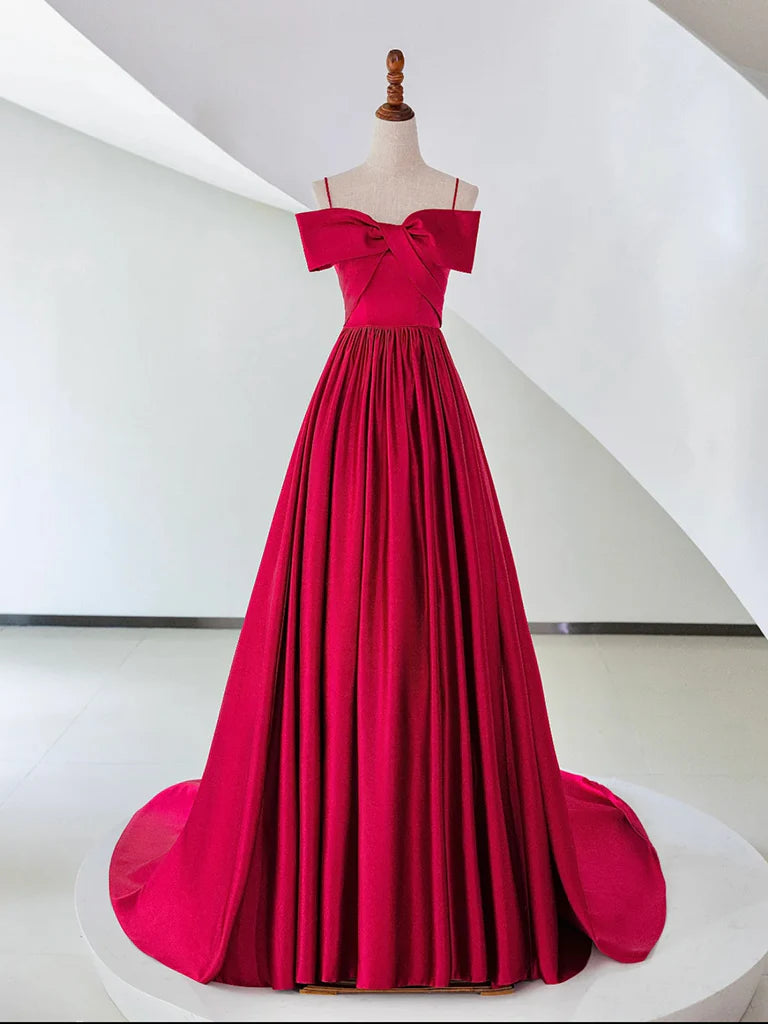 Elegant woman wearing a red A-line off-shoulder satin long prom dress.