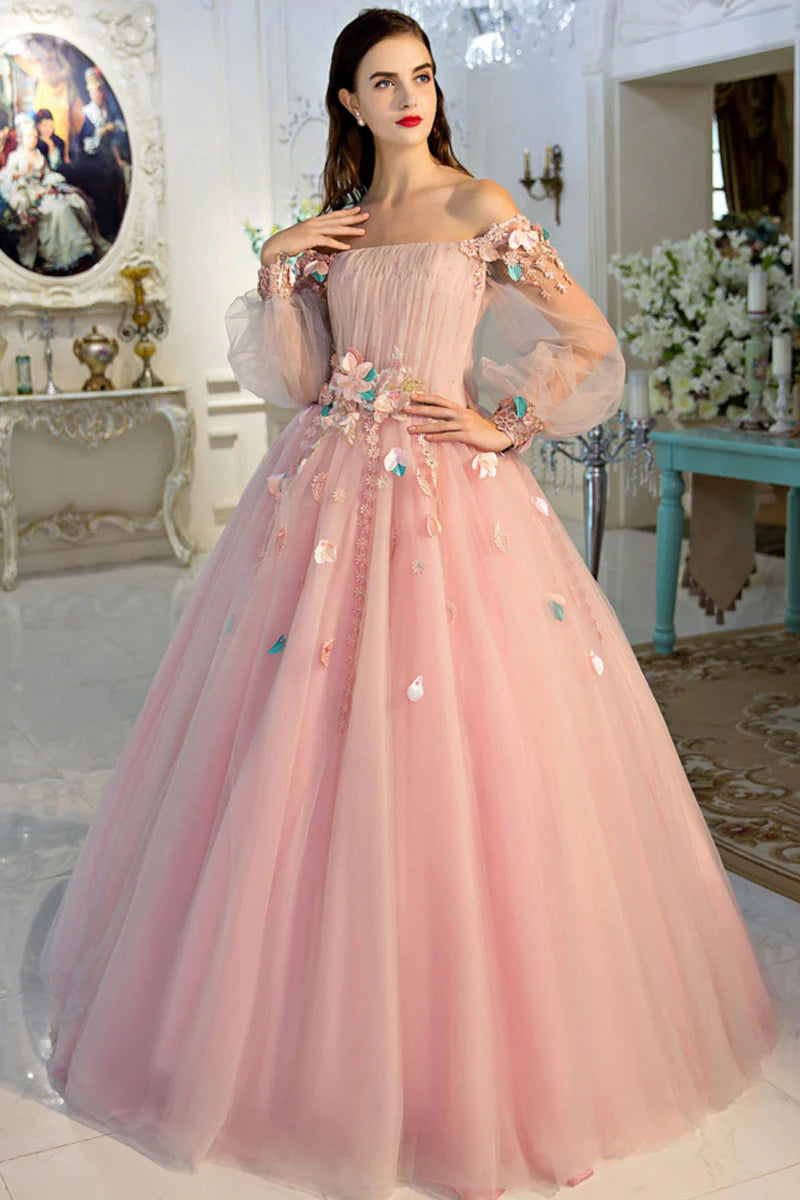 Model wearing a pink off-shoulder tulle long prom dress.