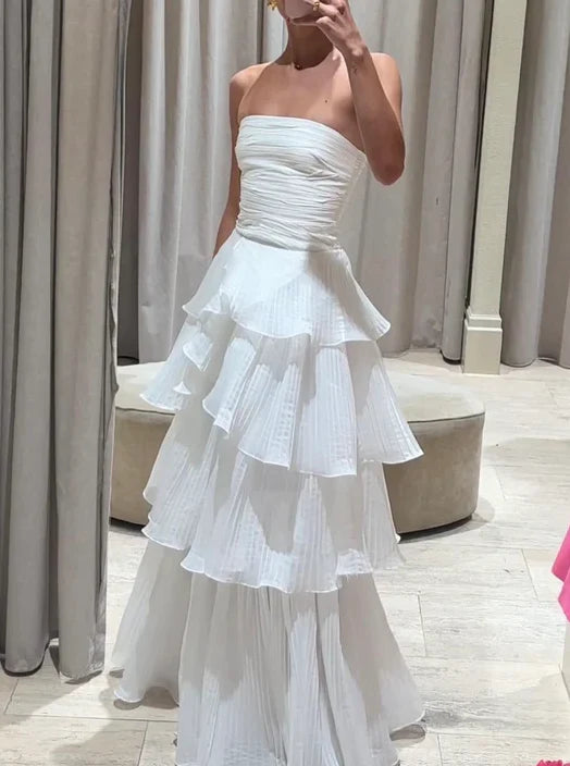 Back view of a model in the white A-line off-the-shoulder multi-layer long prom dress.