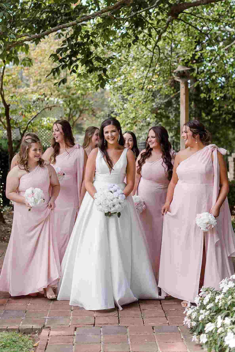Elegant pink one-shoulder A-line satin long bridesmaid dress with a thigh-high slit.