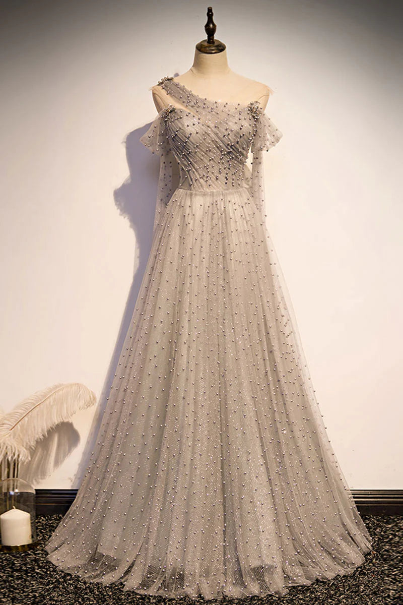 Elegant gray one-shoulder long tulle prom dress on a model, front view.