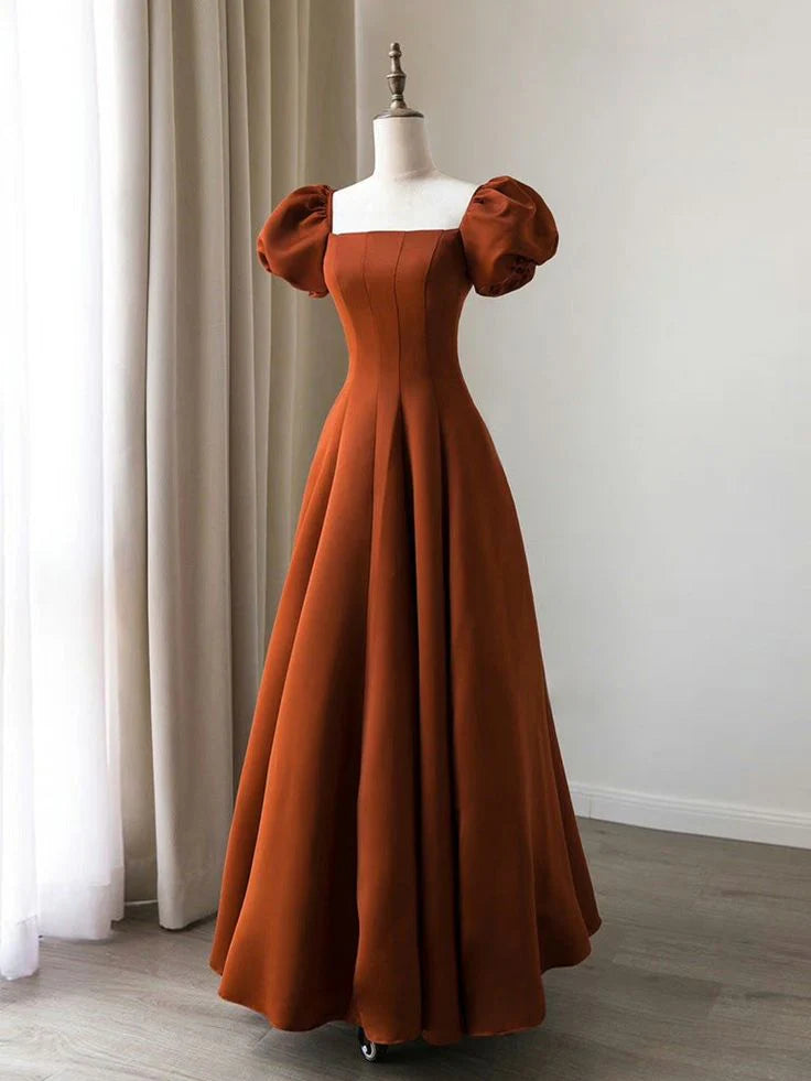 Model wearing an elegant A-line satin long prom dress with puff sleeves.